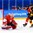 GANGNEUNG, SOUTH KOREA - FEBRUARY 20: Germany's Leonhard Pfoderl #83 (not shown) gets the puck past Switzerland's Jonas Hiller #1 to score a first period goal with Philippe Furrer #54 and Germany's Felix Schutz #55 in front during qualification playoff round action at the PyeongChang 2018 Olympic Winter Games. (Photo by Andrea Cardin/HHOF-IIHF Images)

